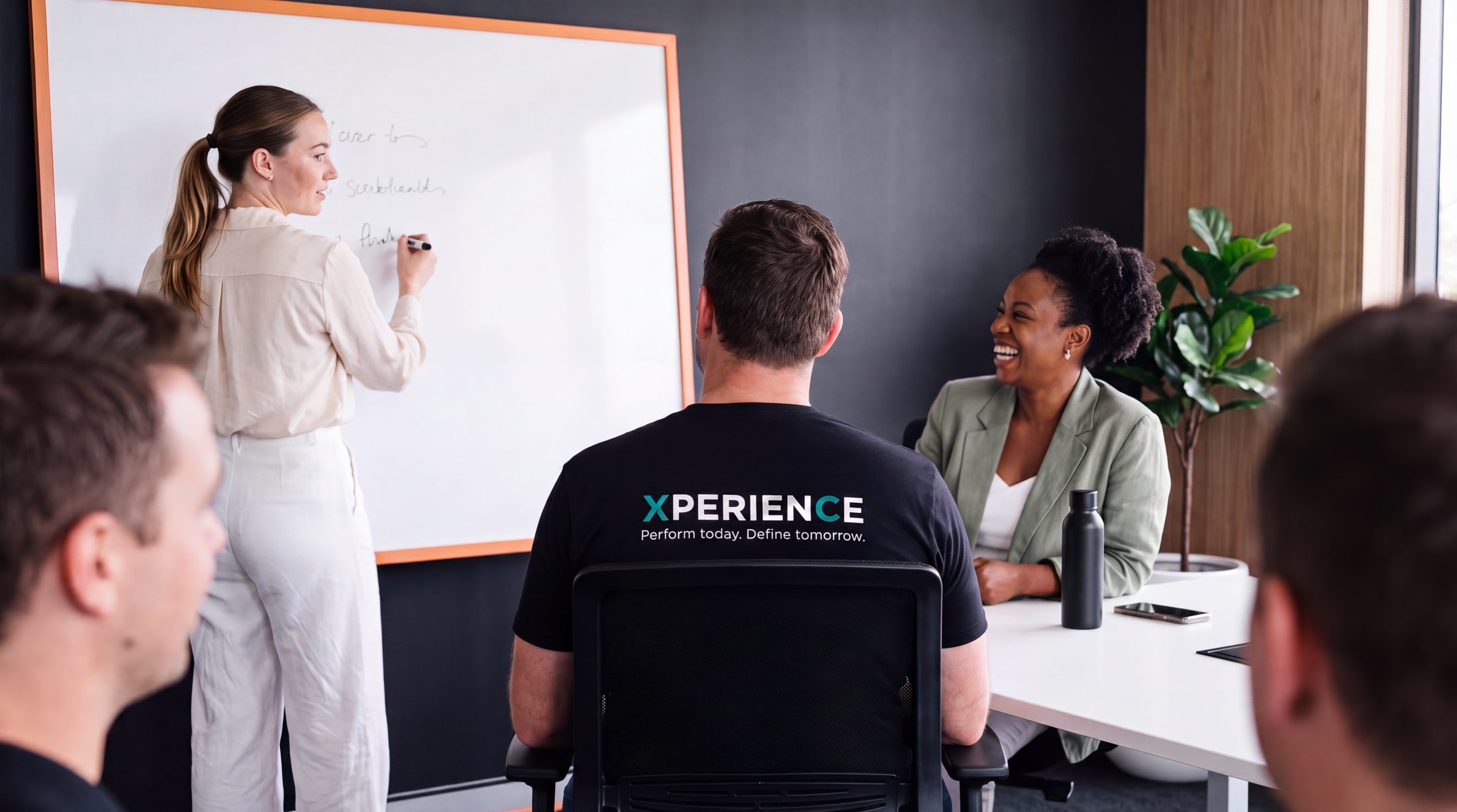 Xperience director working alongside a client leadership team